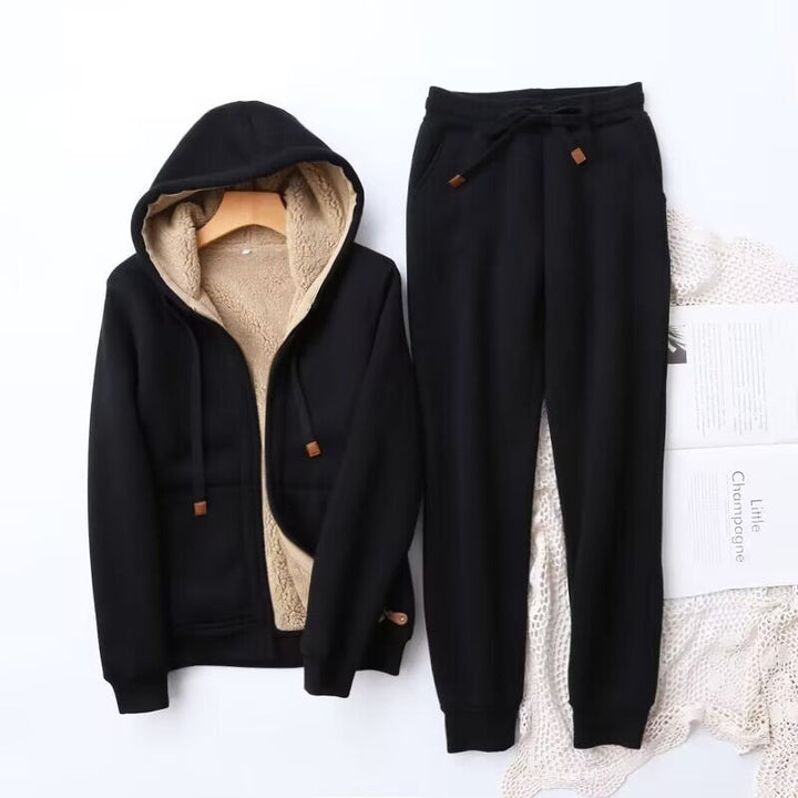 Cozy women's winter hoodie and jogger set in a soft, heather gray fabric, perfect for loungewear or casual outfits.