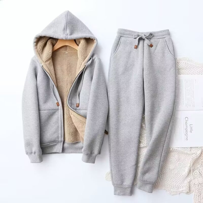 Comfortable black athleisure two-piece set for women, featuring a relaxed-fit hoodie and matching joggers, ideal for winter.