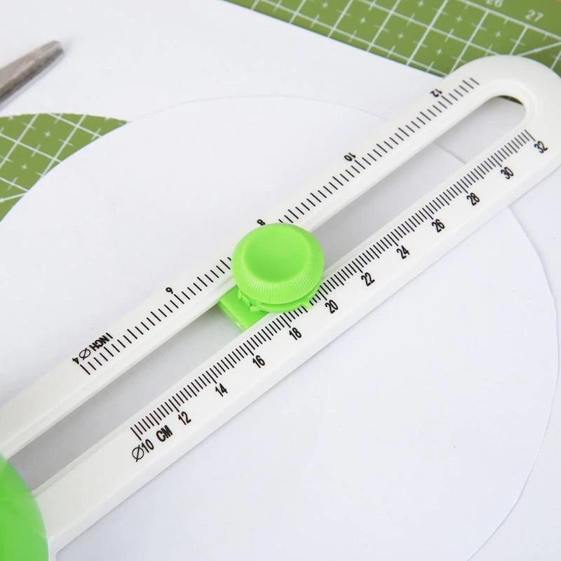 Crafting Circle Cutter Tool alongside paper and fabric swatches, ready for a DIY art project.