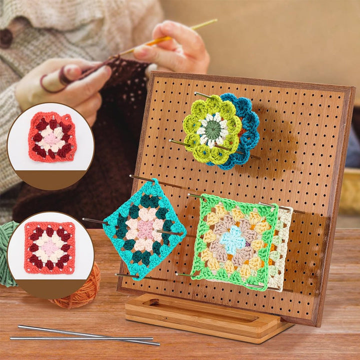 Arrangement of crochet blocking board and knitting tools, ready for a crafting session