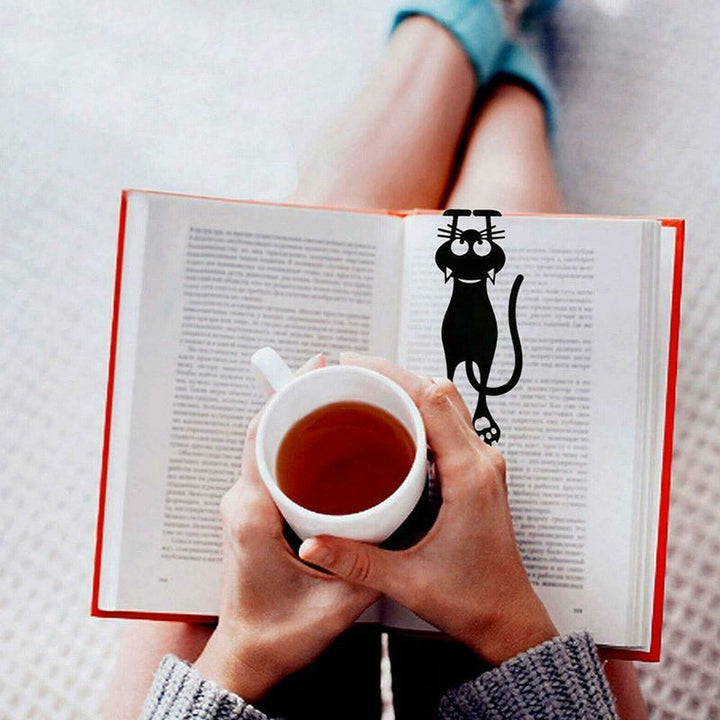 Adorable kitten bookmark in black, a charming pagemarker for readers and office stationery users.