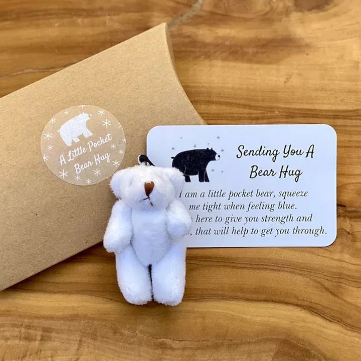 Child holding an encouraging pocket bear plush toy keychain, a perfect small gift for kids.