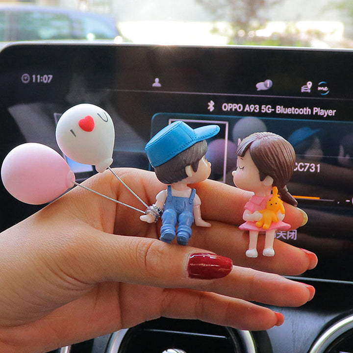Adorable couple figurine for car dashboard, resin ornament, charming car interior decor.