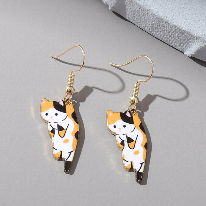 Elegant women's cat earrings with a delicate dangle, ideal for adding a cute touch to outfits.