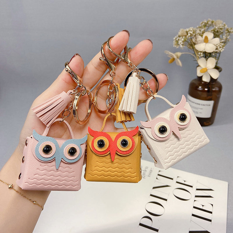 Cute mini handbag keychain in pink PU leather, stylish accessory and storage for small items
