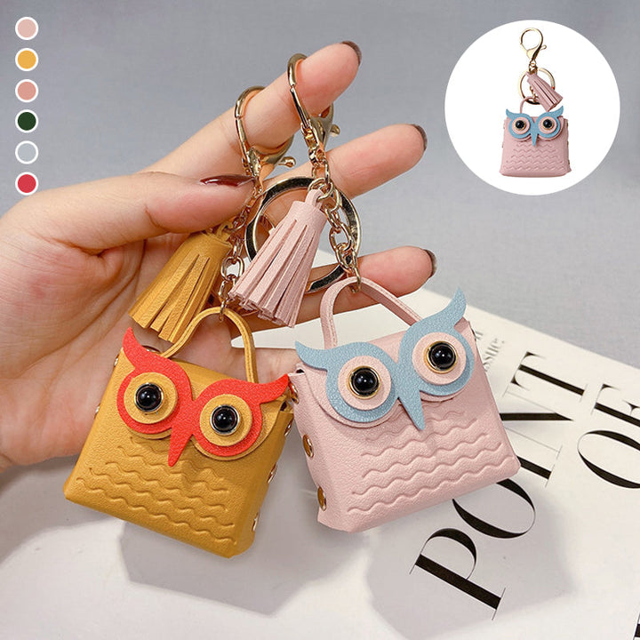 Women's mini handbag keychain with zipper closure, perfect for coins or earbuds, purple color