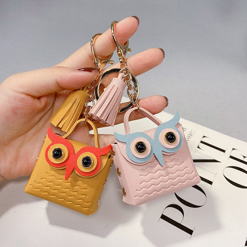 Mini handbag keychain attached to a set of keys, demonstrating its portable accessory use