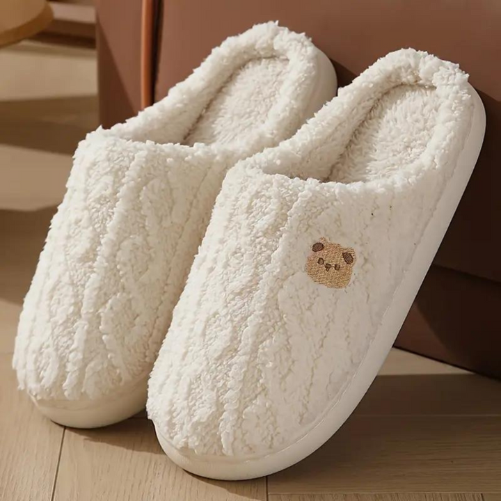 Cute pink plush slip-on indoor slippers for women, perfect for cozy spring lounging at home.