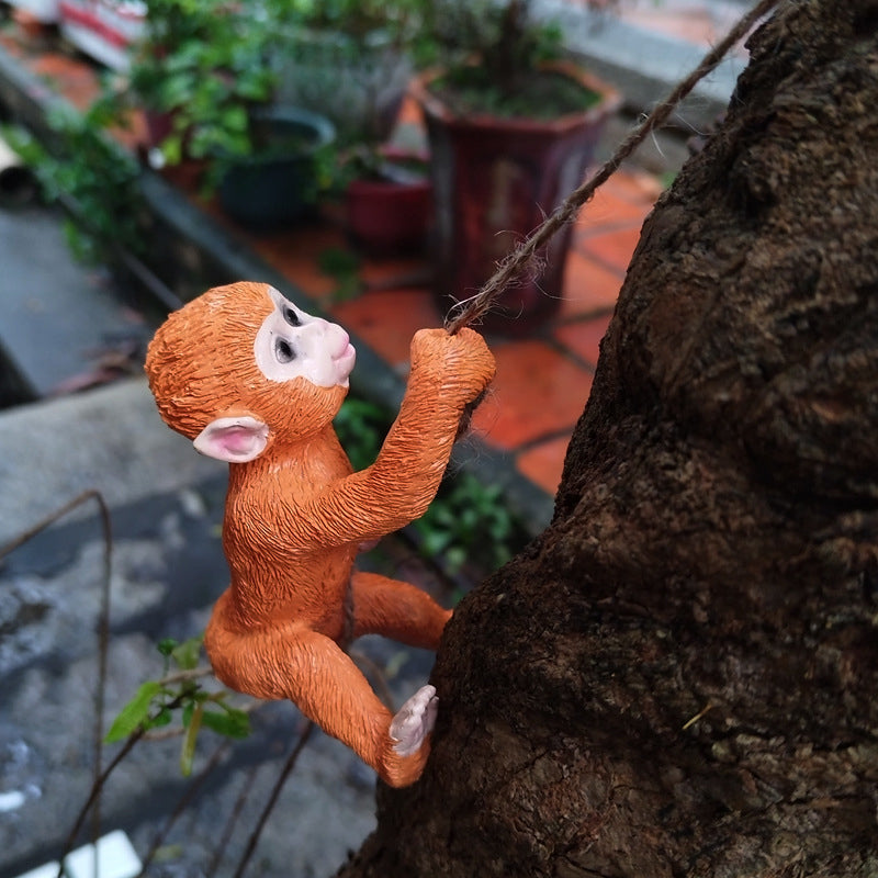 Forest animal tree hugger resin decorative ornament, perfect for woodland garden themes.