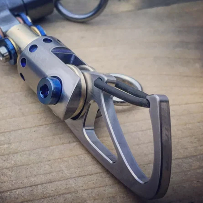 Sleek titanium cyberpunk keychain, futuristic design suitable for all genders. Keywords: titanium, unisex, cyberpunk, accessory