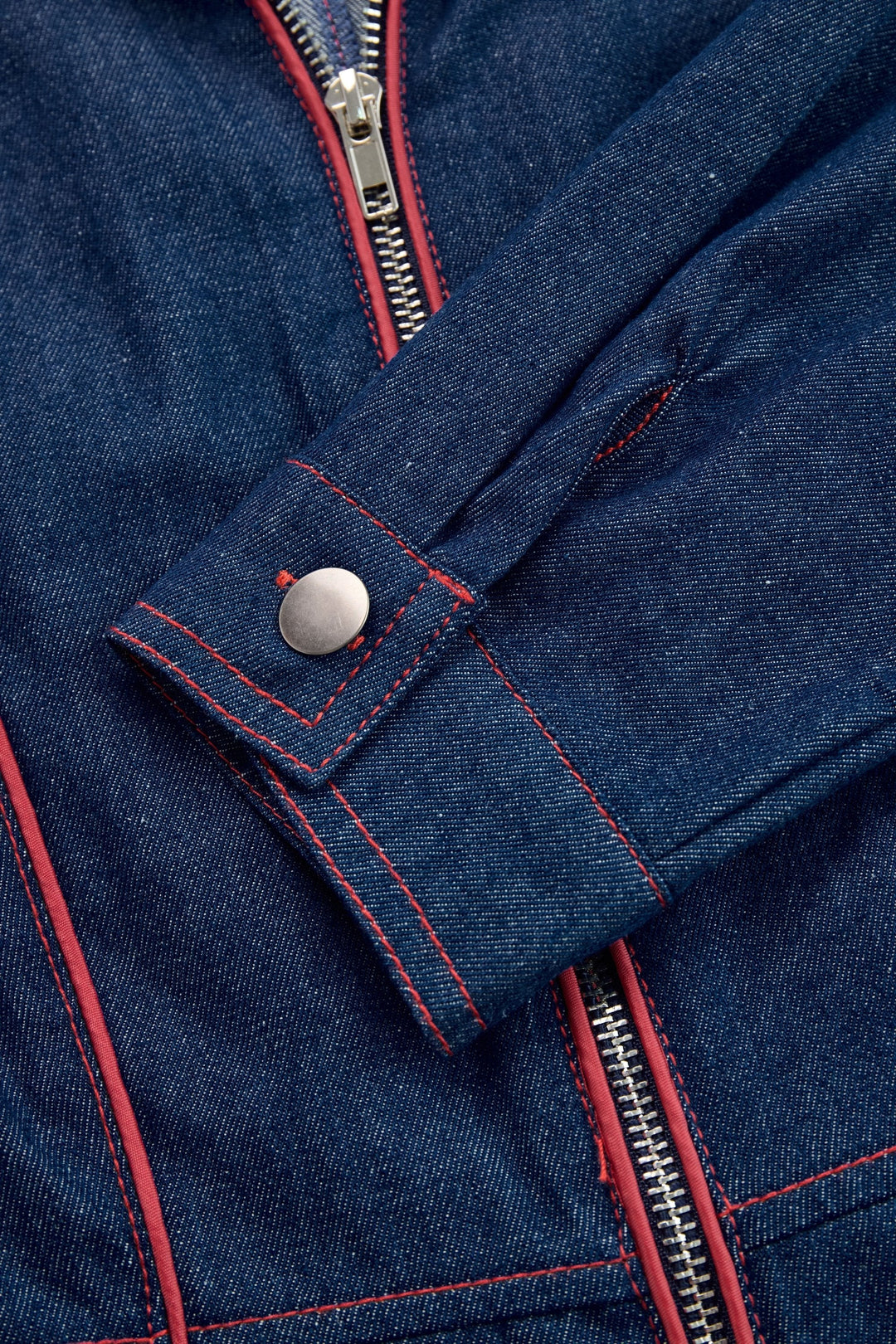 Smart casual women's dark blue jumpsuit. Wide leg design with long sleeves and a modern zip front.