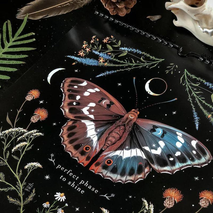 Dark Forest Lunar Calendar hanging on a wall, showcasing its unique nature-inspired design