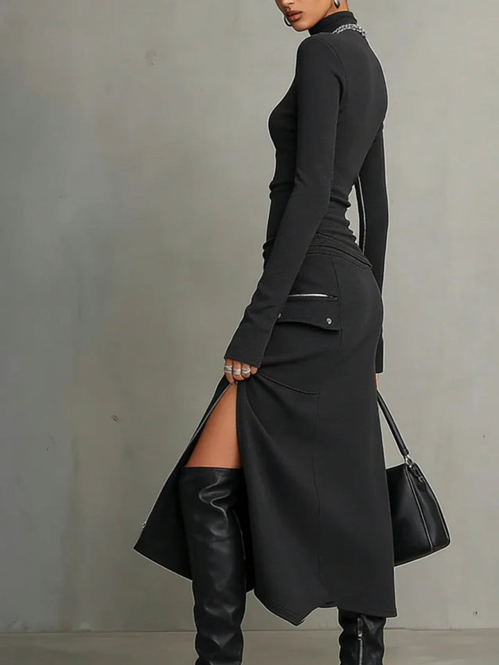 Edgy dark grey women's matching set: long-sleeve turtleneck top and a midi skirt with zipper pocket detail.