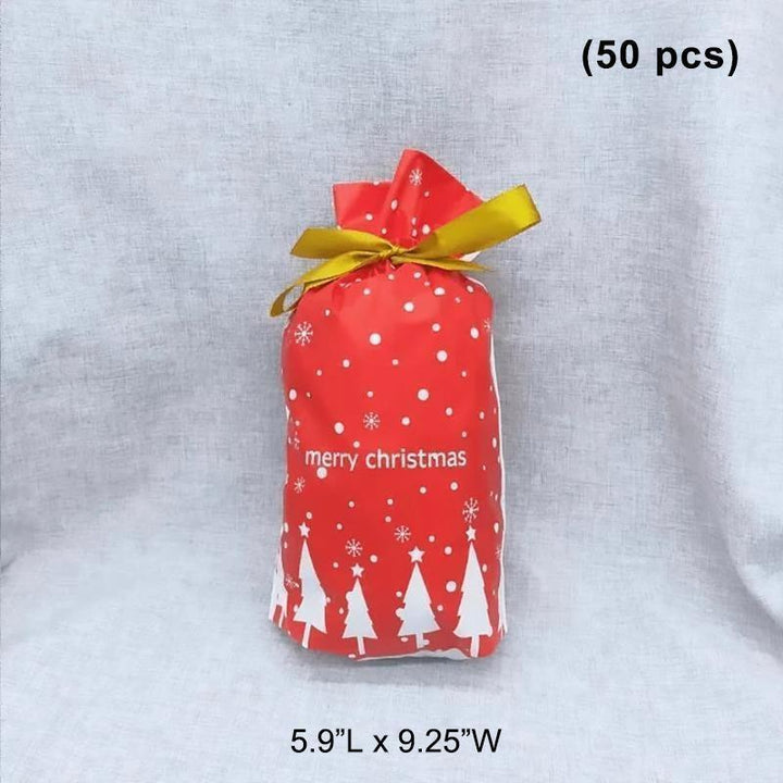 Elegant gold and white decorative gift bag with ribbon drawstring for festive Christmas gifts.