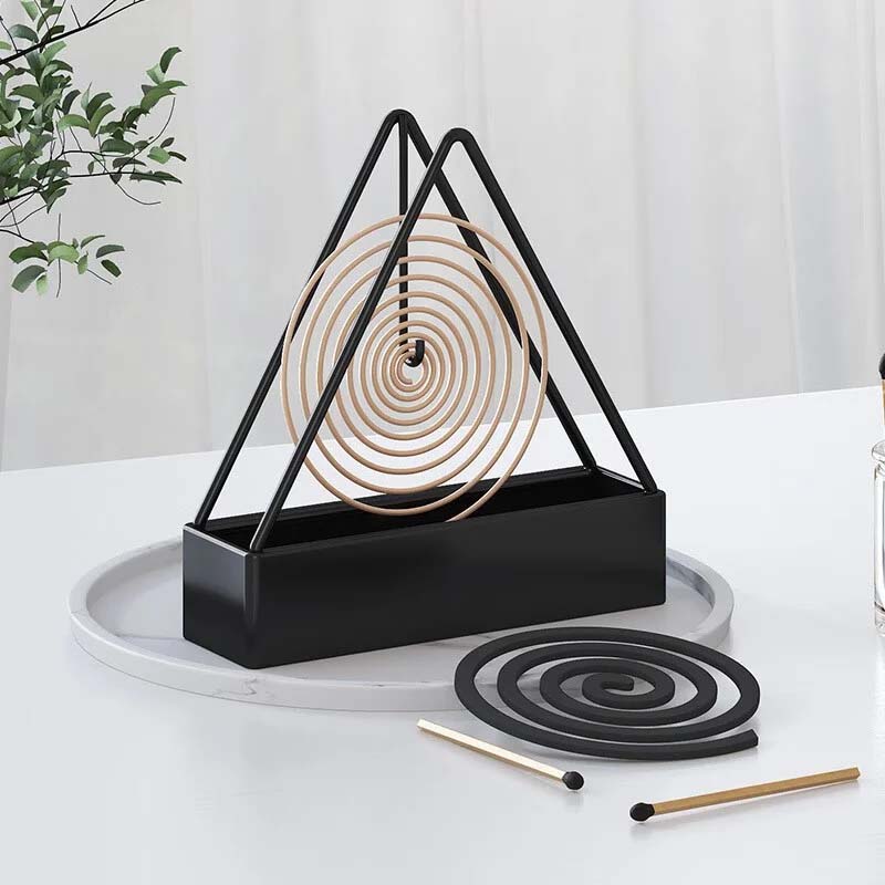 Compact iron mosquito coil holder, easy to hang and ideal for small balconies or camping trips.
