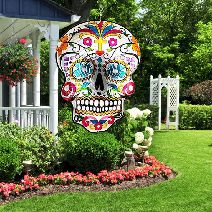 Close-up of spinning Sugar Skull Wind Spinner, intricate design, backyard accent