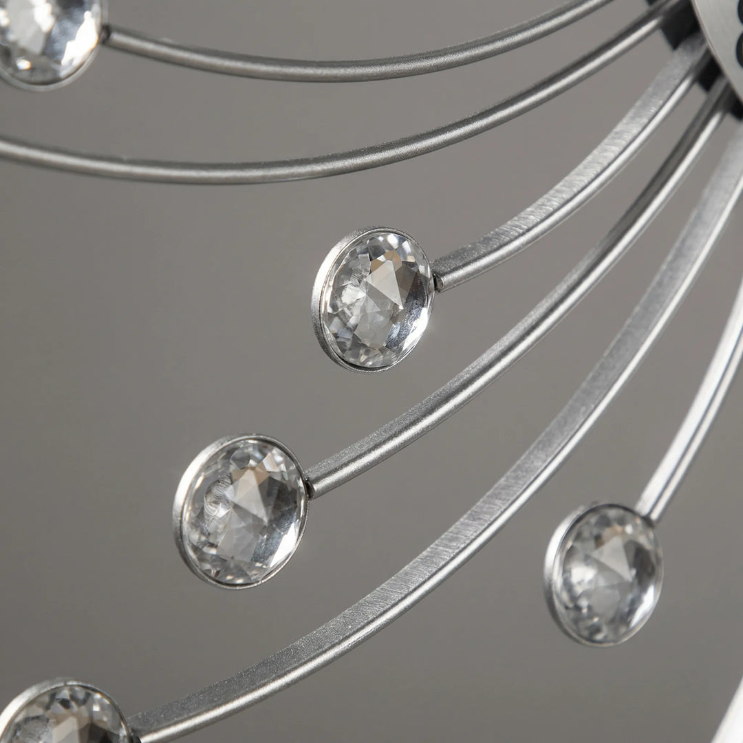 Stunning sunburst wall clock with sparkling accents, perfect modern transitional decor to elevate any living space.