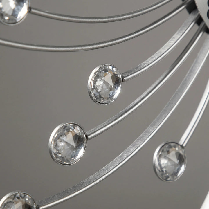 Stunning sunburst wall clock with sparkling accents, perfect modern transitional decor to elevate any living space.