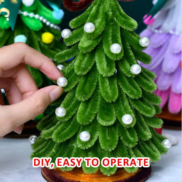 DIY craft Christmas tree kit components: green pipe cleaners, star topper, and various ornaments