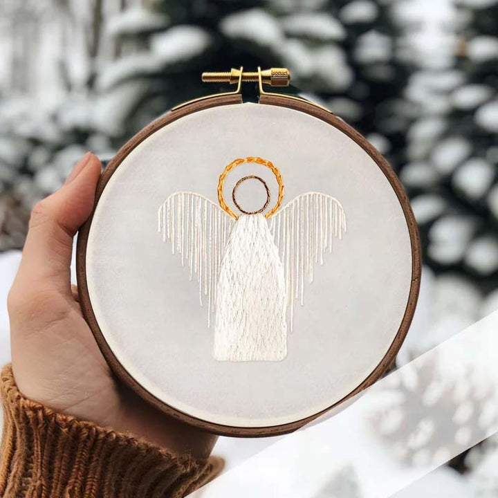 Detailed view of embroidered Mary, Joseph, and baby Jesus from the Nativity Scene kit