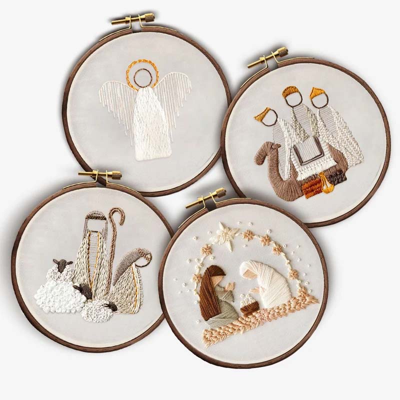 Person proudly holding their completed DIY Nativity Scene embroidery, a lovely keepsake