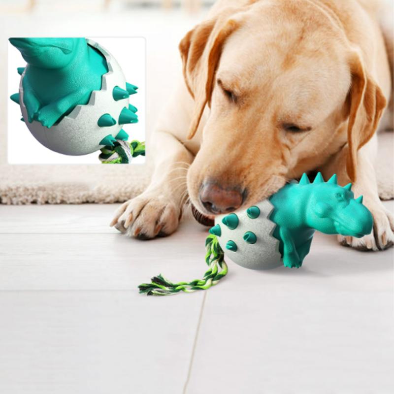 Green dinosaur egg chew toy for dogs with textured surface, ideal for strong chewers and dental cleaning.