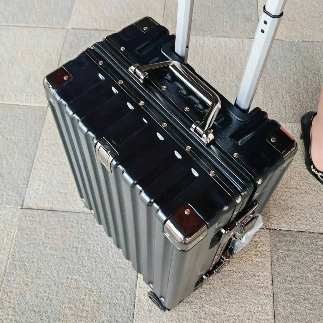 Spacious checked bag with a durable exterior and secure locking frame, perfect for long vacation travel.