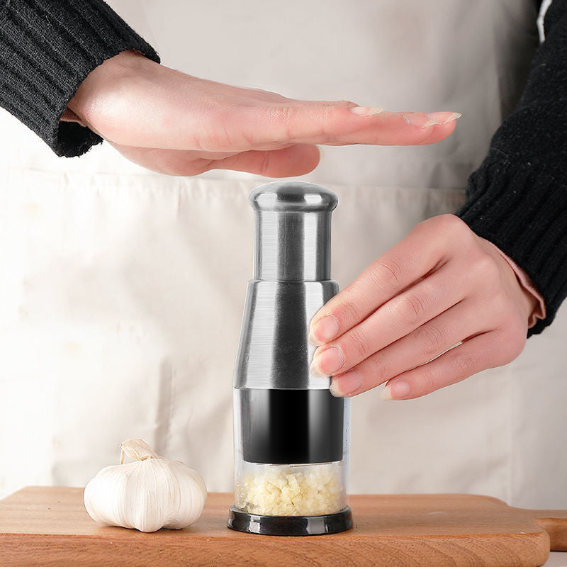 Close-up of a durable stainless steel garlic press kitchen tool