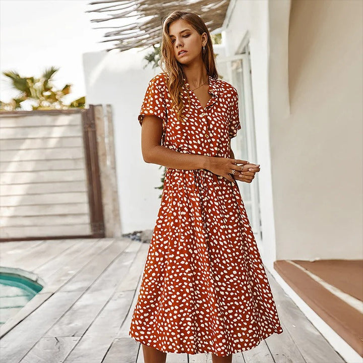 Vibrant printed midi dress for women, great for vacation or everyday summer wear. Stylish and comfortable.