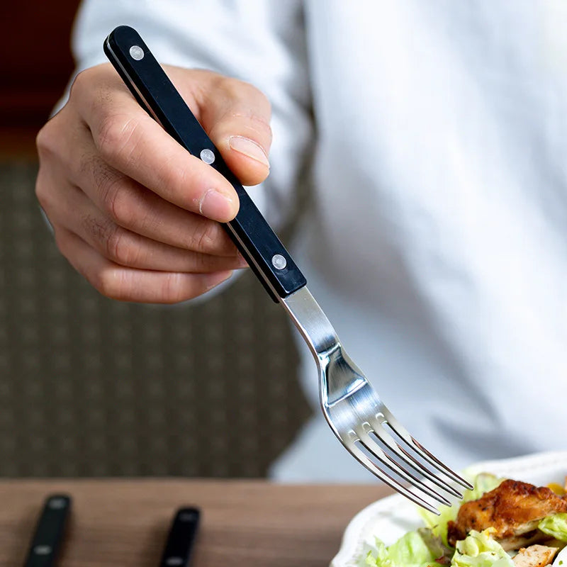 Dining cutlery set of 24 pieces, showcasing an elegant engraved design, ideal for any mealtime.