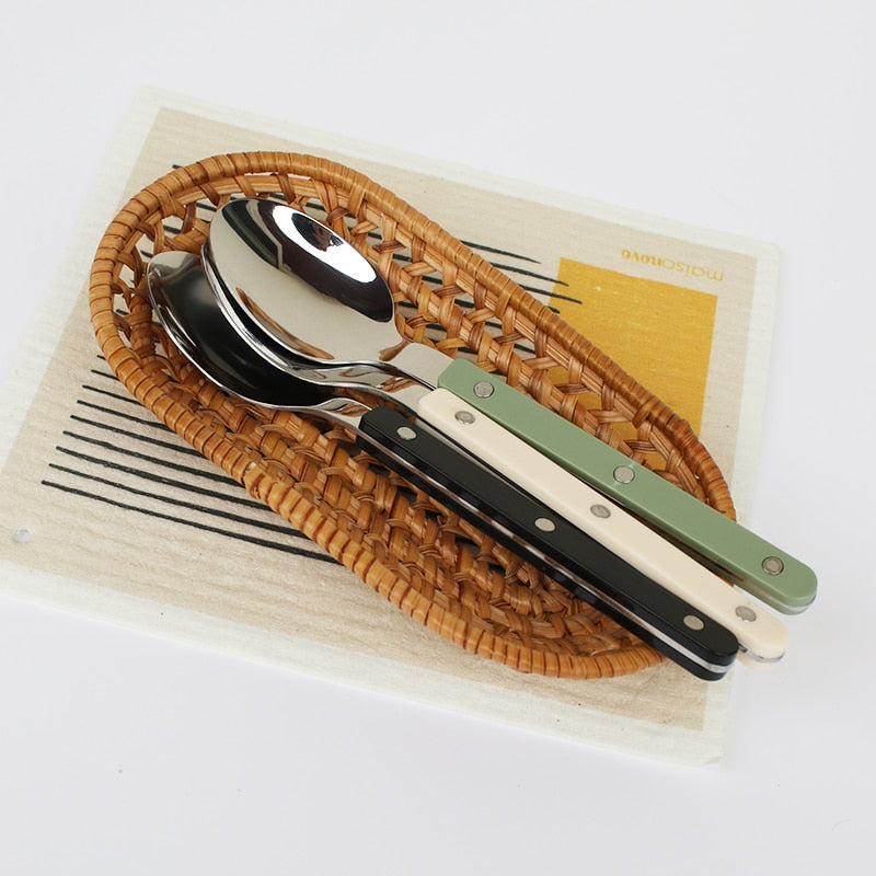 Kitchen flatware: 24-piece engraved stainless steel set, adding elegance to your table setting.