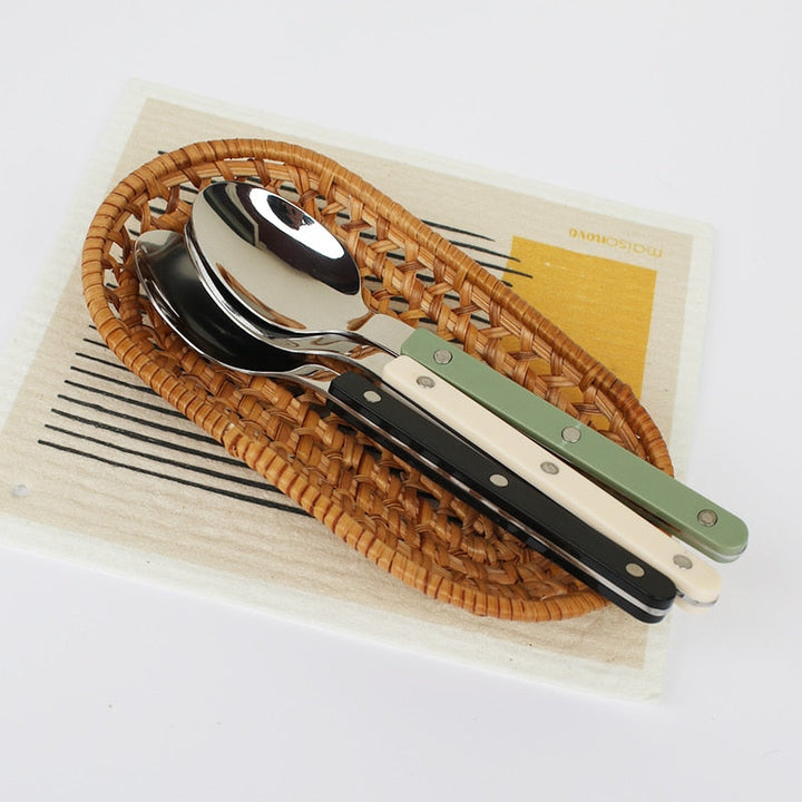 Kitchen flatware: 24-piece engraved stainless steel set, adding elegance to your table setting.