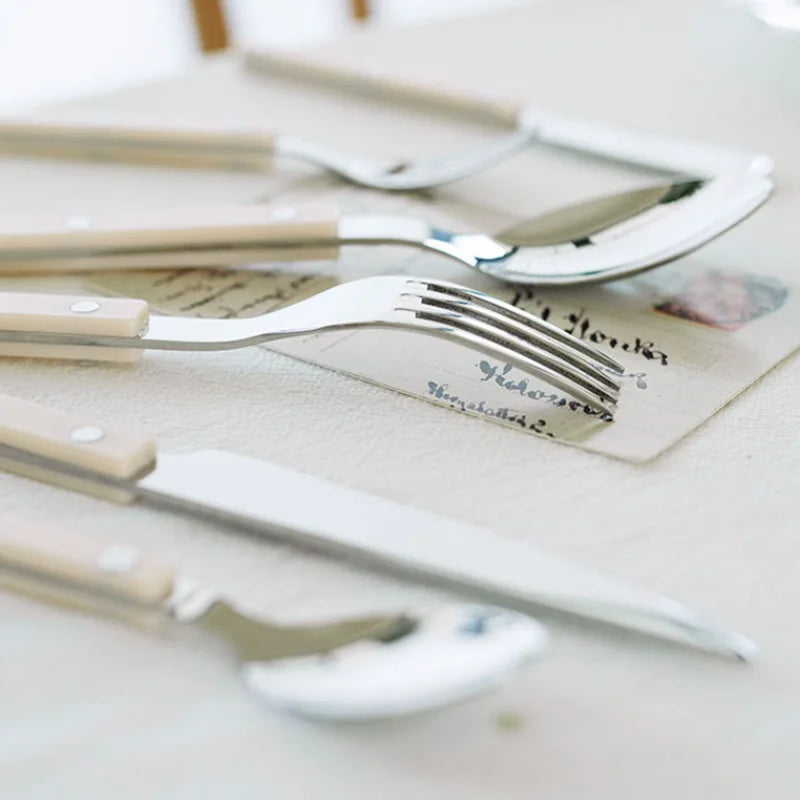 Complete 24-piece elegant engraved cutlery set for stylish kitchen and dining table settings.