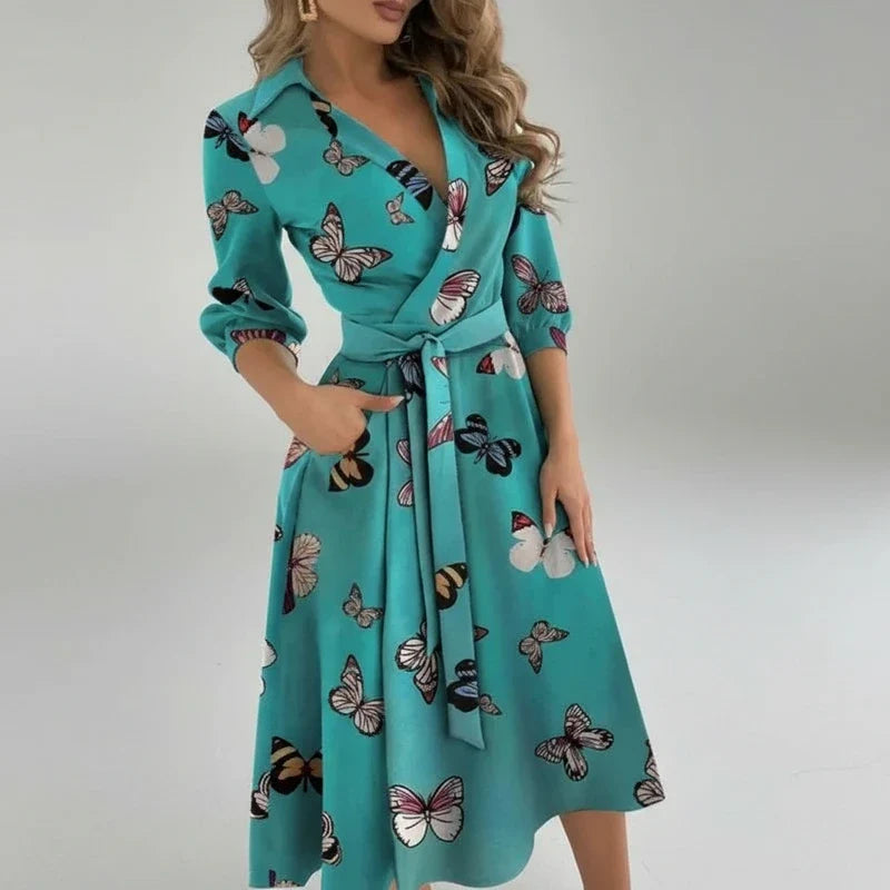 Chic women's A-line midi dress with a flattering belt. Ideal for elegant spring outfits.