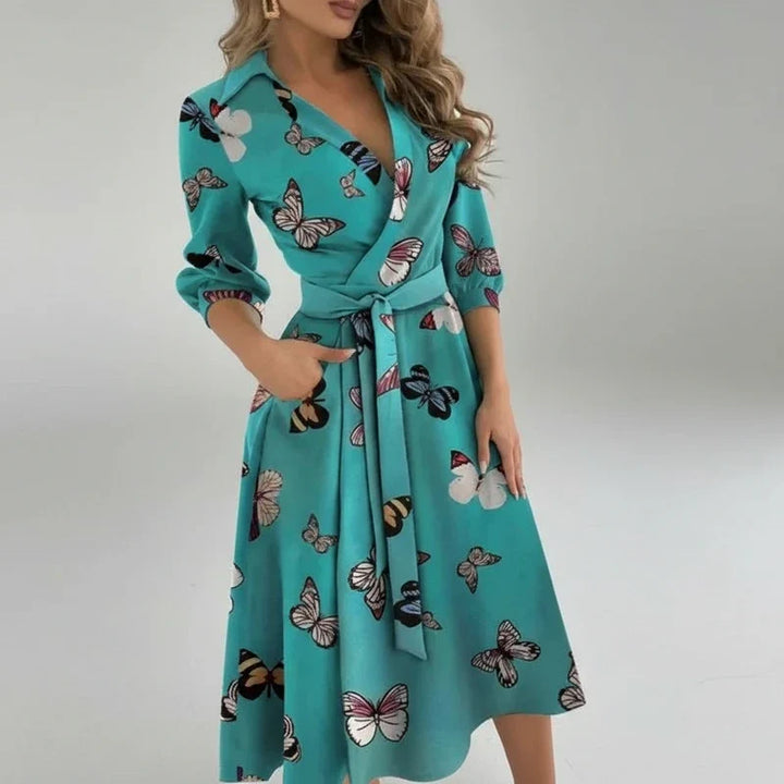 Chic women's A-line midi dress with a flattering belt. Ideal for elegant spring outfits.