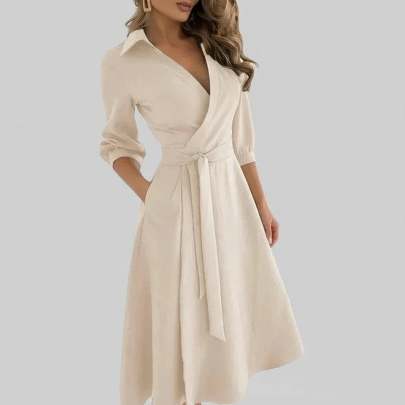 Women's elegant A-line midi dress, belted, with V-neck. Casual spring/summer fashion.