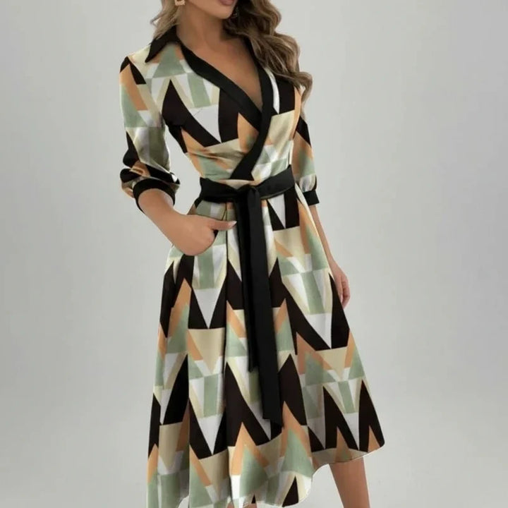 Flowy women's A-line midi dress with a belt. Elegant V-neck design for versatile spring wear.