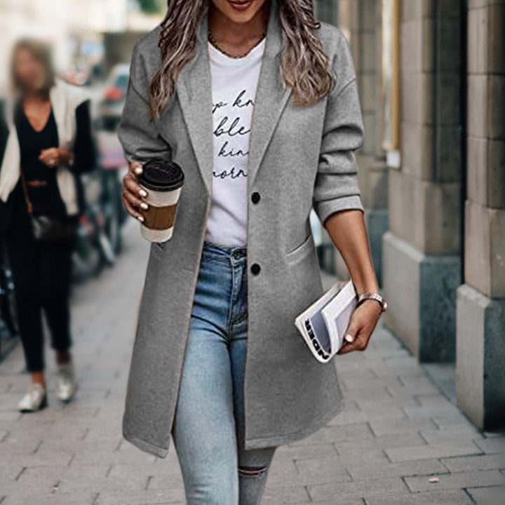 Warm & cozy women's long fitted winter coat, ideal outerwear for chilly autumn days & classic style.