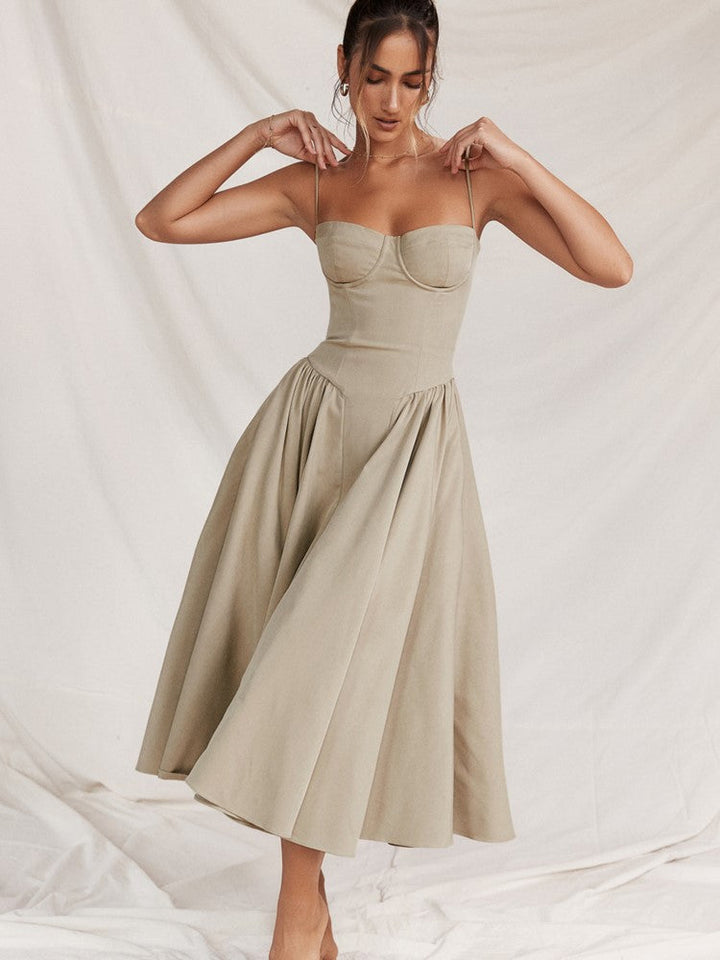 Women's formal midi dress with an elegant pleated hem, suitable for evening and special occasions.