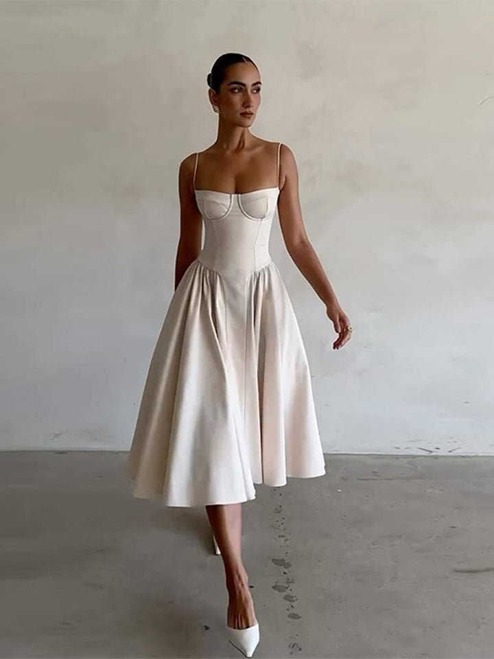 Chic women's midi evening dress, backless design with a flowing pleated skirt for elegance.