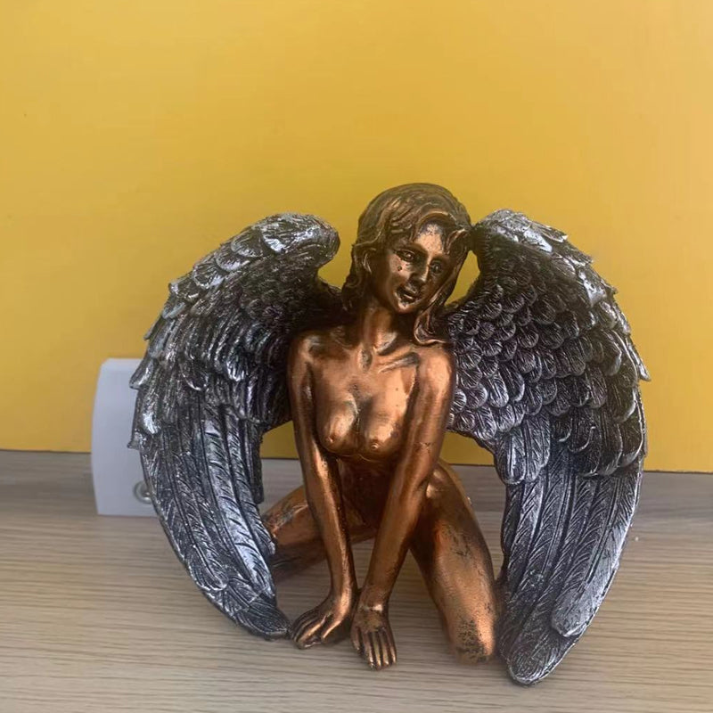 Angel wings kneeling figure, a serene decoration for any home or office space