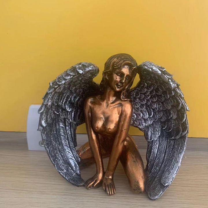 Angel wings kneeling figure, a serene decoration for any home or office space
