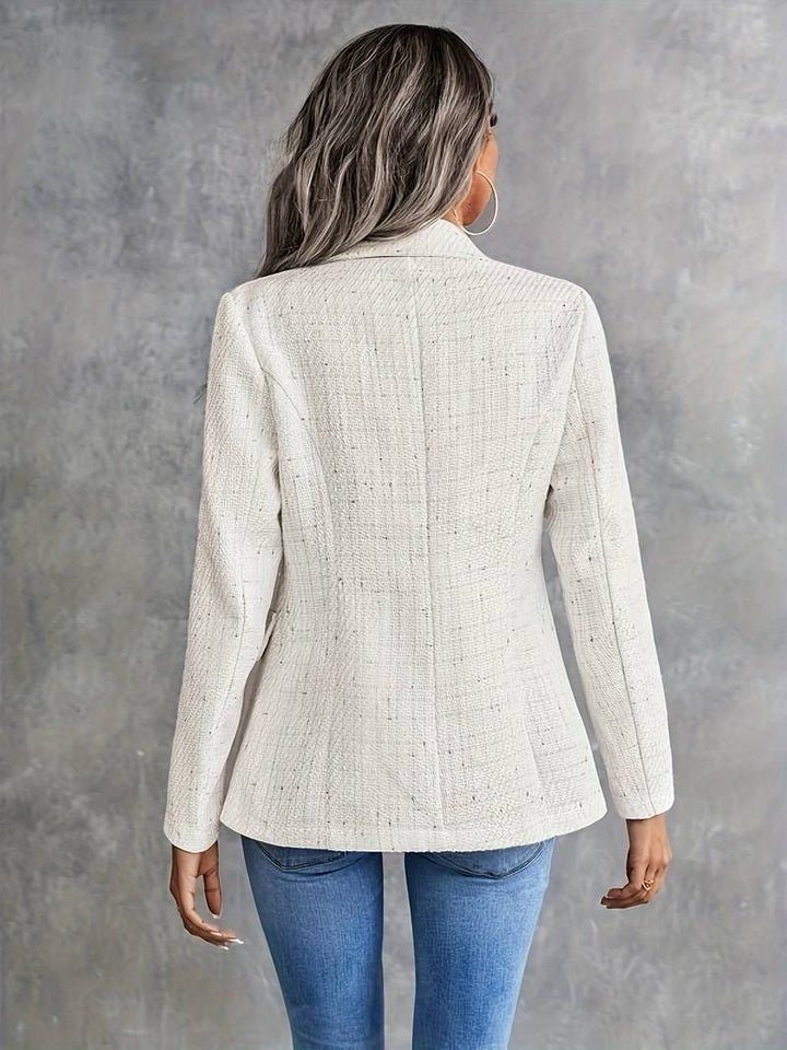 Classic women's double-breasted blazer jacket in beige, a chic outerwear piece for any occasion.