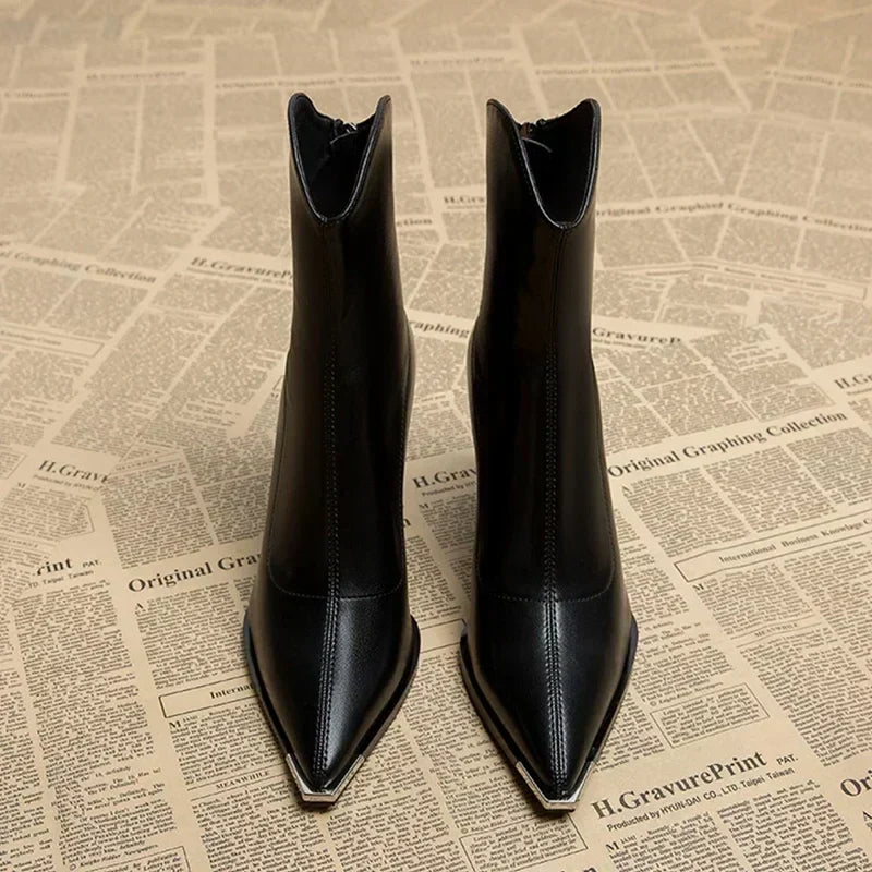 Comfortable women's block heel ankle boots in black, designed with a classic pointed toe.