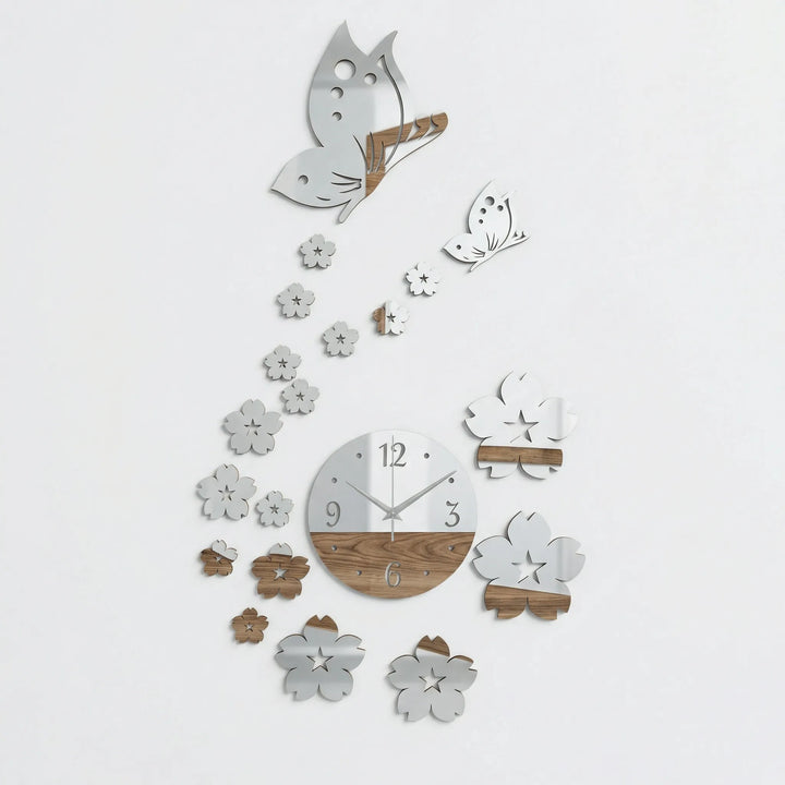 Modern black butterfly wall clock. Elegant floral details & quartz movement make a statement in nature-inspired decor.