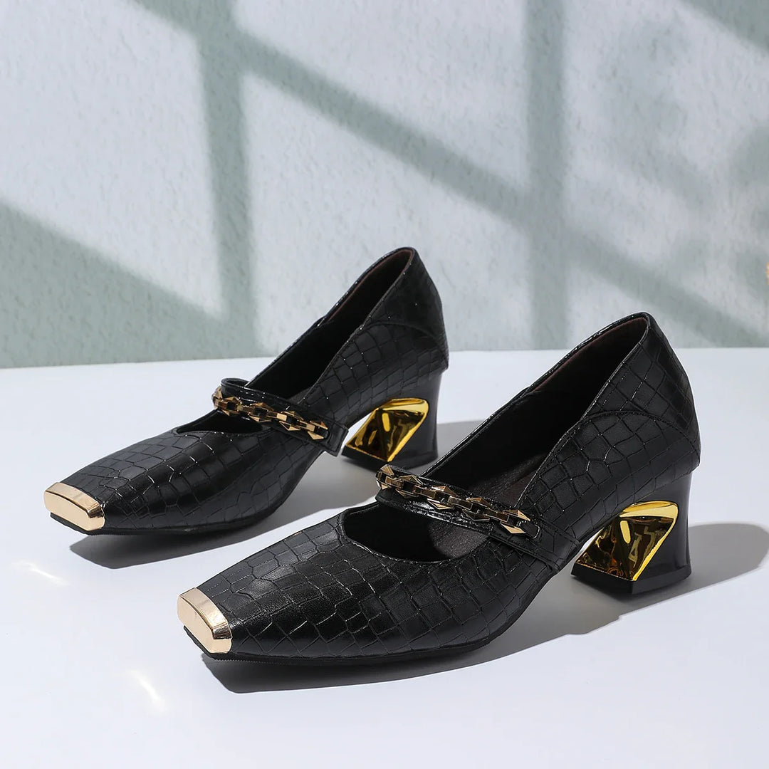 Elegant and comfortable women's bloc heel sandals made from faux leather, with a distinctive chain.
