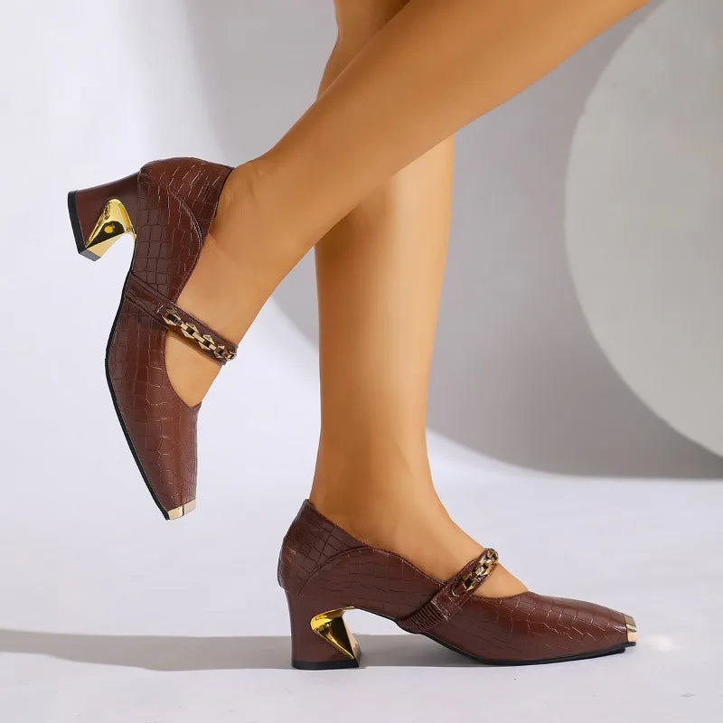 Pair of elegant black block heel sandals with chain embellishment, ideal for women's formal events.