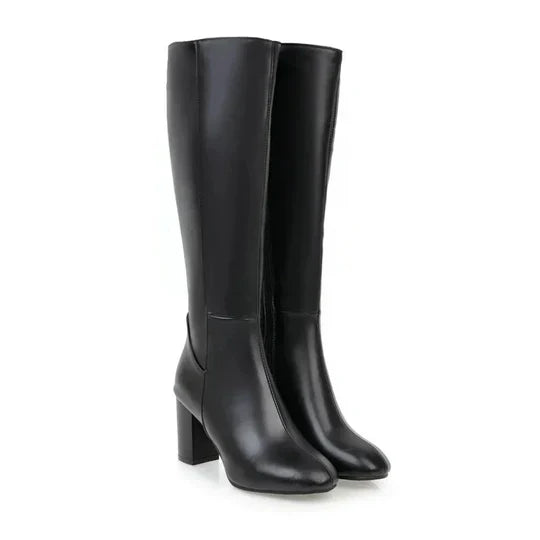 Fashionable women's white knee-high heeled boots, perfect for an elegant and chic look.