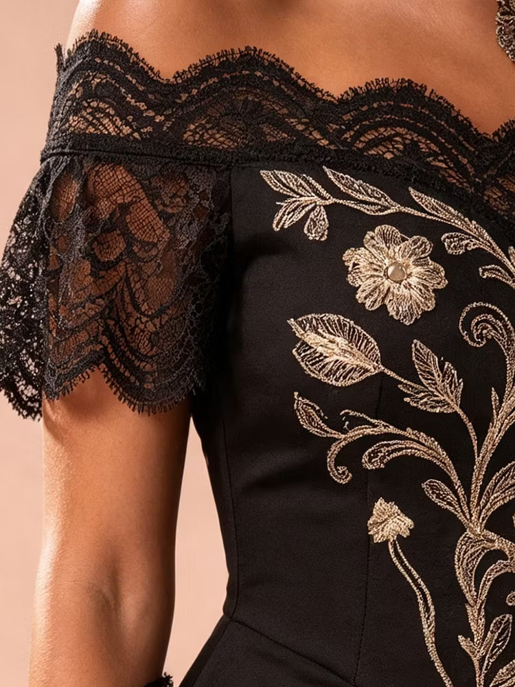 Stunning black embroidered midi dress for women, featuring elegant gold details, off-shoulder style & asymmetrical hemline.