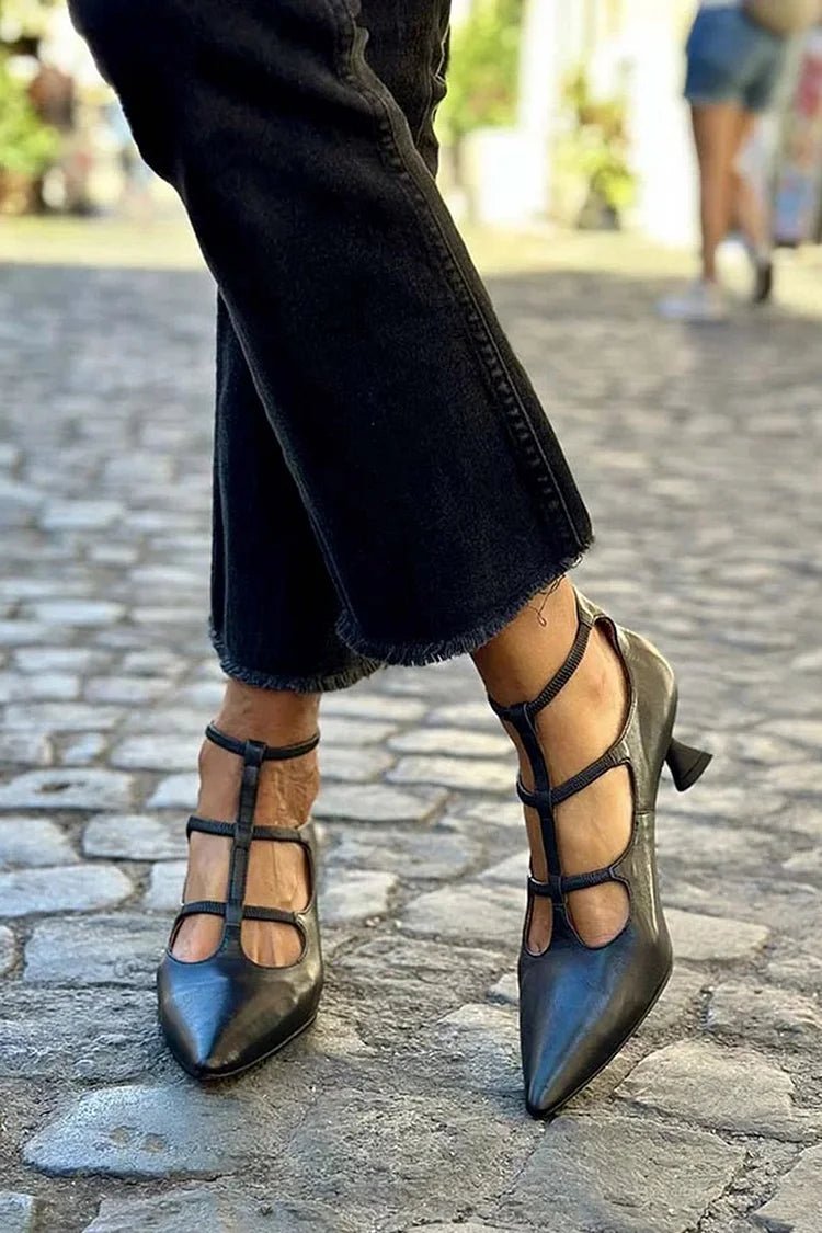 Elegant black wedding shoes for women, featuring a cage strap, pointed toe, and kitten heel. Perfect for formal wear & parties.